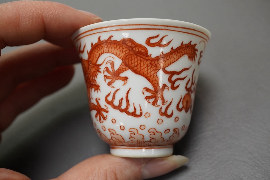 A pair of Chinese iron red ‘dragon’ cups, Guangxu six character mark and probably of the period (1875-1908)